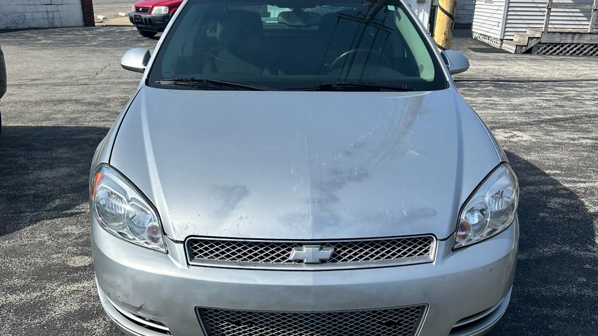 2013 Silver Chevrolet Impala LT (2G1WB5E3XD1) with an 3.6L V6 DOHC 16V FFV engine, 6-Speed Automatic transmission, located at 2710A Westlane Rd., Indianapolis, IN, 46268, (317) 291-2000, 39.885670, -86.208160 - Photo#1